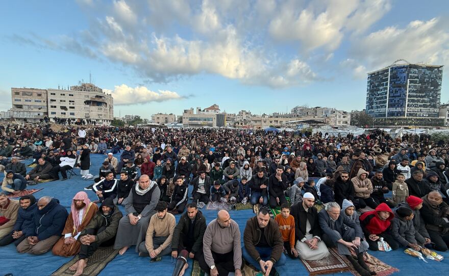 People gather for prayers on Eid in Gaza City on Friday.