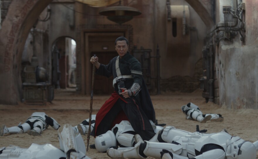Donnie Yen's Chirrut Îmwe takes out some stormtroopers in "Rogue One: A Star Wars Story."