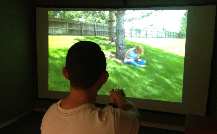 An LAPD officer trains inside a force option simulator at the police department's headquarters in March.