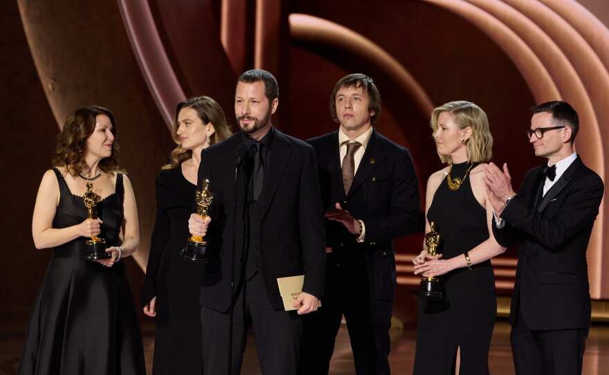 Raney Aronson-Rath, Mstyslav Chernov and Michelle Mizner accept the Oscar® for Documentary Feature Film during the live ABC telecast of the 96th Oscars® at the Dolby® Theatre at Ovation Hollywood on Sunday, March 10, 2024.