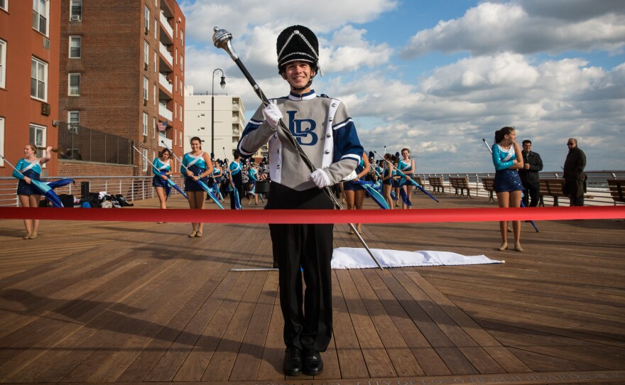 The Long Beach High School marching band prepares to march down the Long Beach boardwalk during a ribbon-cutting ceremony Friday.