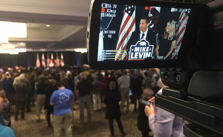 Mike Levin, Democratic candidate for the 49th Congressional District, is shown through a video camera on election night, Nov. 6, 2018.