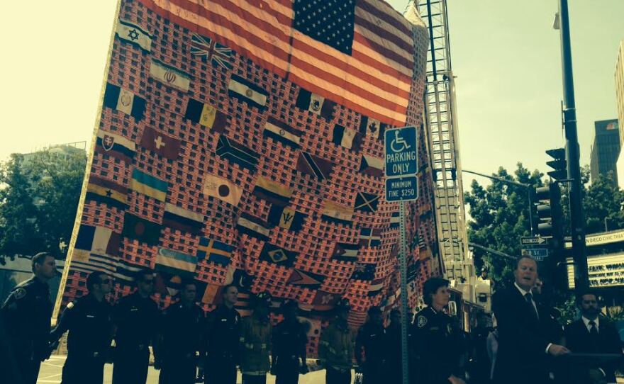 San Diego Mayor Kevin Faulconer is pictured speaking in front of the 9/11 Memorial Flag, May 12, 2015.