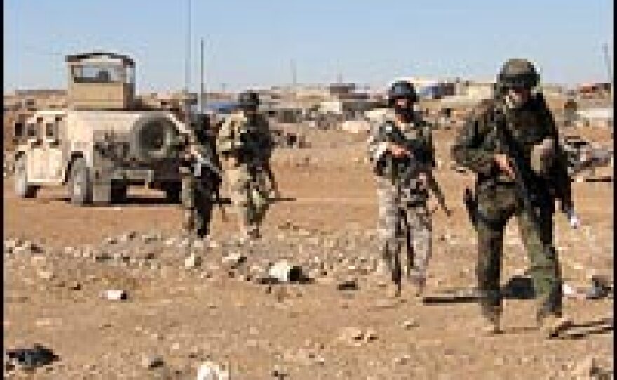 U.S. and Iraqi troops patrol in Mosul. Members of the 2-7 Cavalry believe the sprawling outdoor vegetable and sheep markets serve as cover for insurgents to smuggle weapons and explosives.