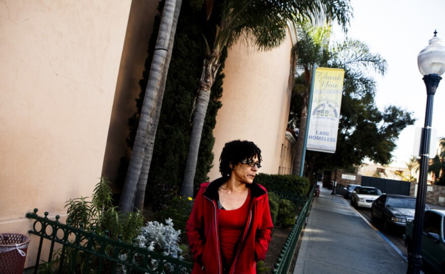 Cheryl Canson stands outside St. Vincent de Paul Village. She moved to a space in the homeless shelter there with her daughter and son after tensions escalated in her older daughter’s home. The family had moved there after being evicted from Section 8 housing following another son’s arrest.