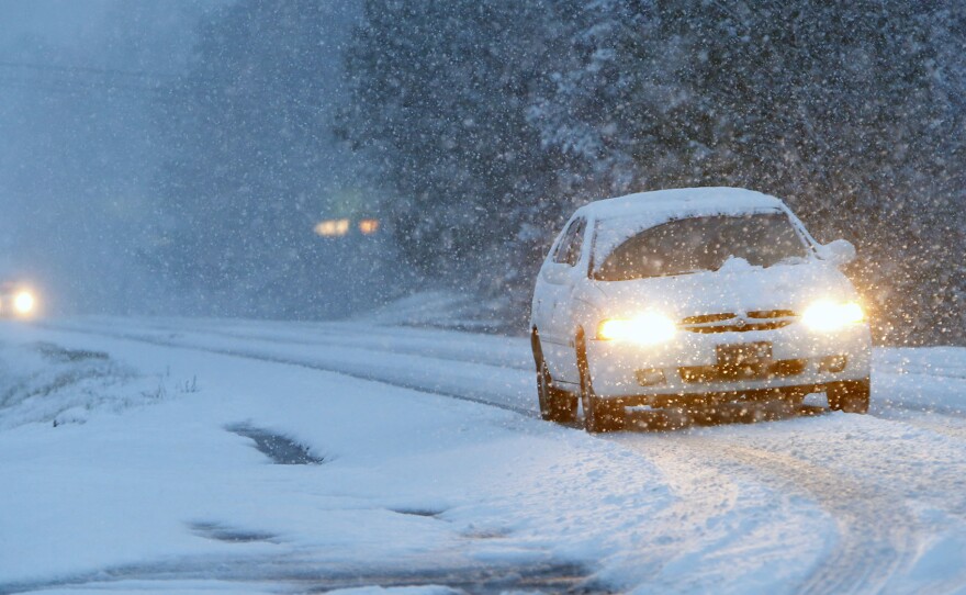 This car was navigating a snowy road early Tuesday in Fort Payne, Ala. The wicked winter weather there is spreading across the Deep South.