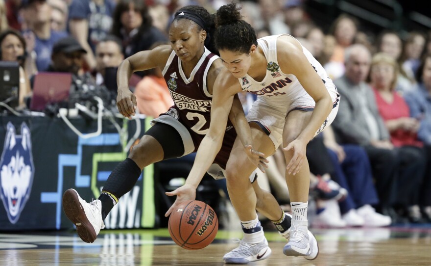 Mississippi State guard Morgan William (2) and Connecticut guard Kia Nurse (11) dive attempting to win control of a loose ball during an NCAA college basketball game in the semifinals of the women's Final Four, Friday March 31, 2017, in Dallas.