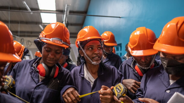 Students take part in a tiling class at the Buildher training facility in Nairobi, Kenya.