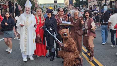 A group of cosplayers pose as cast members from "The Princess Bride" in the Gaslamp Quarter on July 26, 2025.