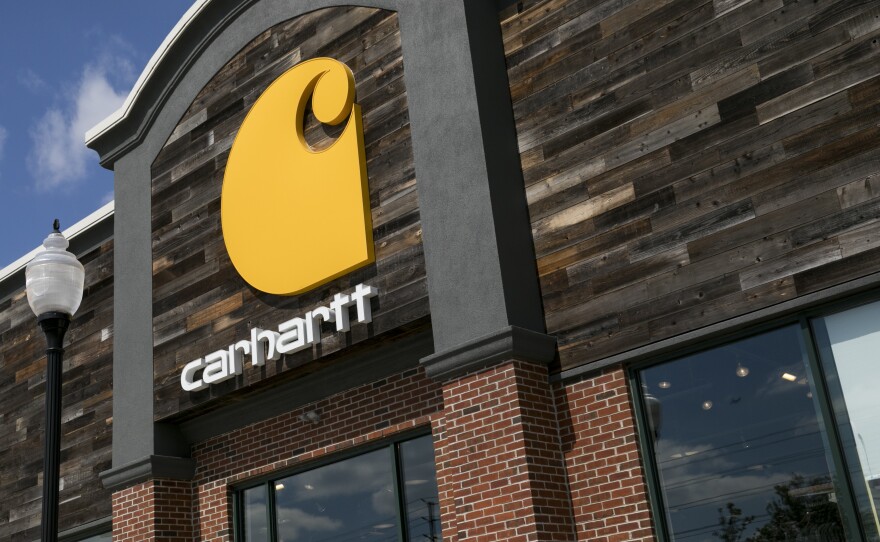 A logo sign outside of a Carhartt retail store location in Cherry Hill, New Jersey on April 11, 2020. The company is facing blowback among some conservatives for its decision to press ahead with a vaccine mandate for its employees.
