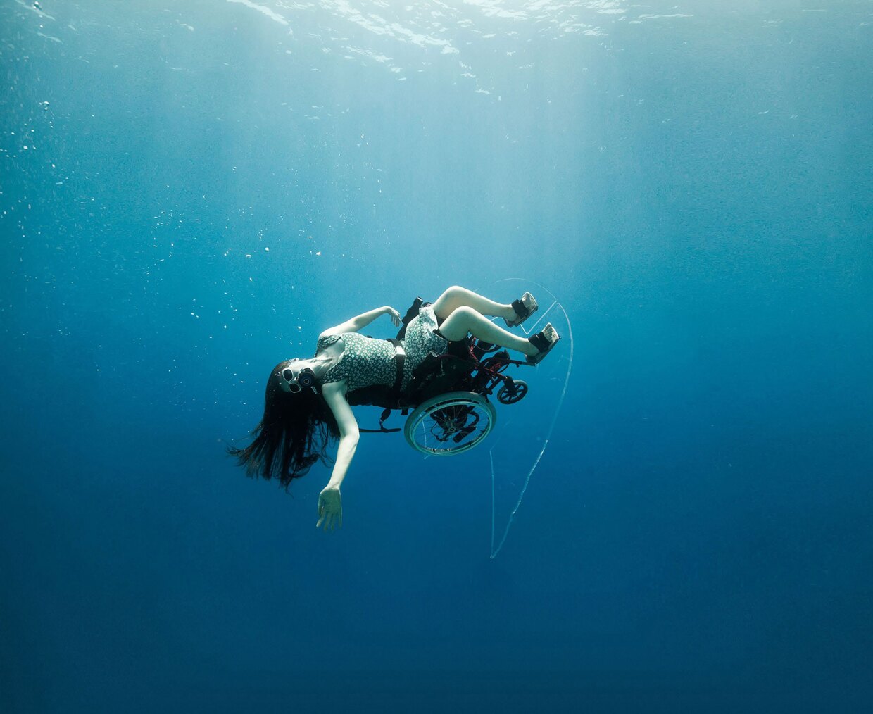 A still from Sue Austin's video work, "Creating the Spectacle! Part 1 - Finding Freedom," is on view at ICA San Diego's Balboa Park location through Jun. 26, 2022.