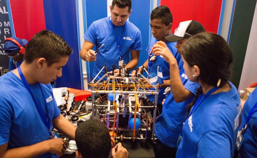 Team Honduras preps for the competition. The members, who come from a remote village, may have lacked resources, but they know that the "world today demands that we understand technology," said one participant.