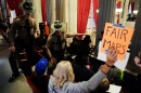 State troopers remove people from the Tennessee House gallery on Thursday during a special session of the state legislature to redraw congressional voting maps.