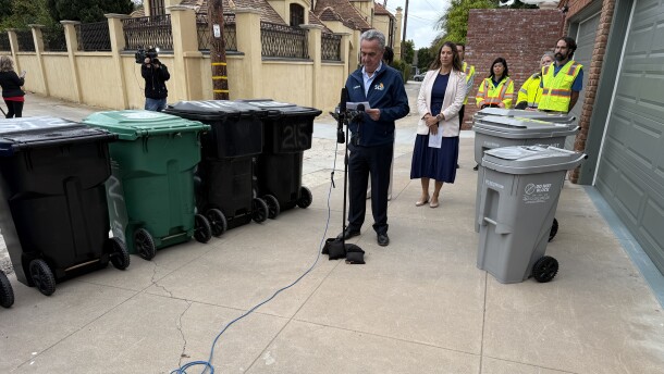 San Diego City Council President Joe LaCava speaks at a press conference to announce the rollout of new high-tech trash bins (right) for the city in La Jolla on Oct. 13, 2025.