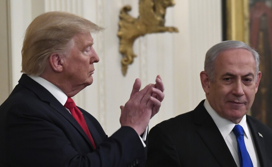 President Donald Trump applauds as Israeli Prime Minister Benjamin Netanyahu speaks during Tuesday's announcement of the Trump administration's plan to resolve the Israeli-Palestinian conflict.