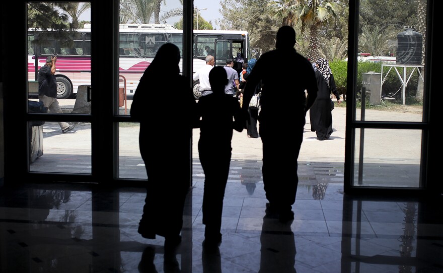Days before Egypt shut down the Rafah border crossing, Palestinians were seen leaving the terminal to get on buses that would take them to Egypt.