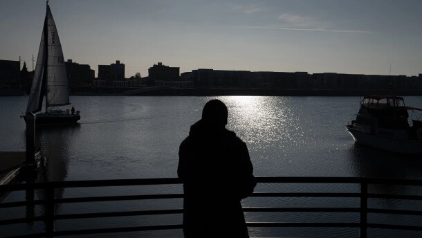 J.M., who prefers to use his initials for privacy, looks out at the San Francisco Bay at Jack London Square, where he walks almost daily for exercise and because he enjoys looking at the water, in Oakland on Dec. 1, 2025. JM received housing support through CARE Court and now lives within walking distance of Jack London.