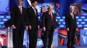 Republican presidential candidates (L-R) former U.S. Sen. Rick Santorum, former Massachusetts Gov. Mitt Romney, former Speaker of the House Newt Gingrich, and U.S. Rep. Ron Paul (R-TX) arrive on stage before a debate at the North Charleston Coliseum January 19, 2012 in Charleston, South Carolina.