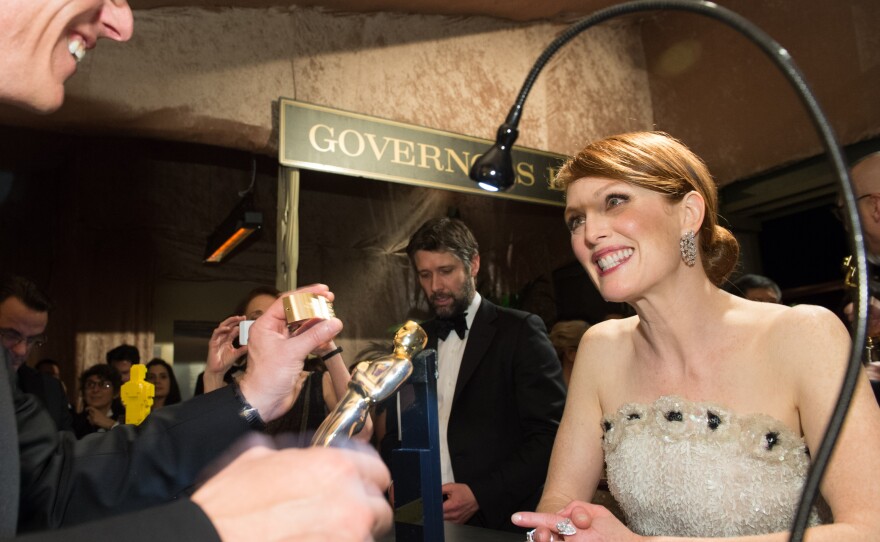 Julianne Moore gets her Oscar engraved for her win as Best Actress for "Still Alice" at the 87th annual Academy Awards, Feb. 22, 2015. 