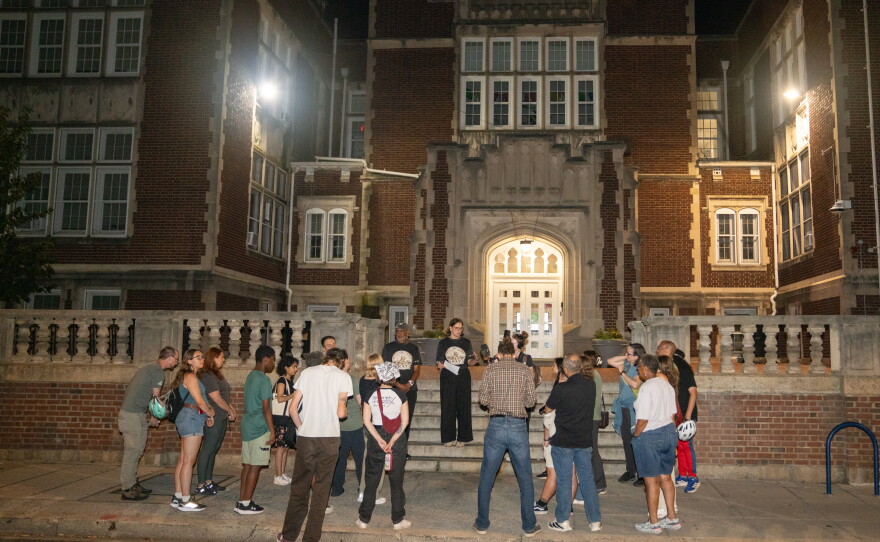 A group gathers for a rat walk in front of the Bruce-Monroe Elementary School in the Park View neighborhood of Washington D.C..