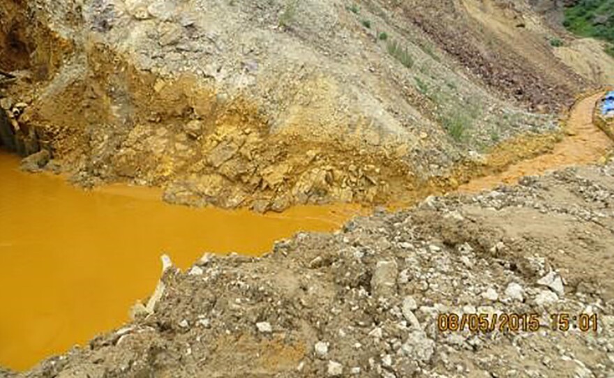 Contaminated wastewater is seen at the entrance to the Gold King Mine in San Juan County, Colo., in this picture released by the Environmental Protection Agency. The photo was taken Wednesday; the plume of contaminated water has continued to work its way downstream.