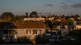 The sun sets over homes in Encinitas on Jan. 29, 2025.