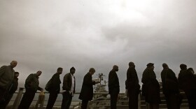 Veterans and family members line up Nov. 23 to attend a career fair at the Intrepid Sea, Air & Space Museum in New York City.