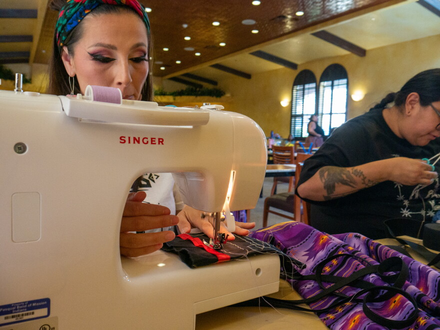 Rebekah Jarvey sews fabric on July 21, 2026.