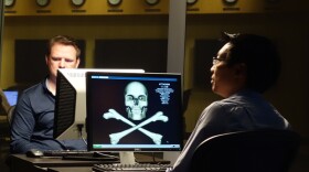 Liam O'Murchu and Eric Chien, Symantec employees who decoded Stuxnet, demonstrating how malware can infect a computer. They were part of what was an ad hoc international effort to understand what STUXNET was.  