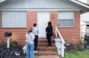 Volunteers with Florida Rising, a progressive nonprofit that organizes residents to take political action on state and local issues, knock on doors in Jacksonville, Fla., to encourage residents to vote no on an amendment that would cut property taxes.