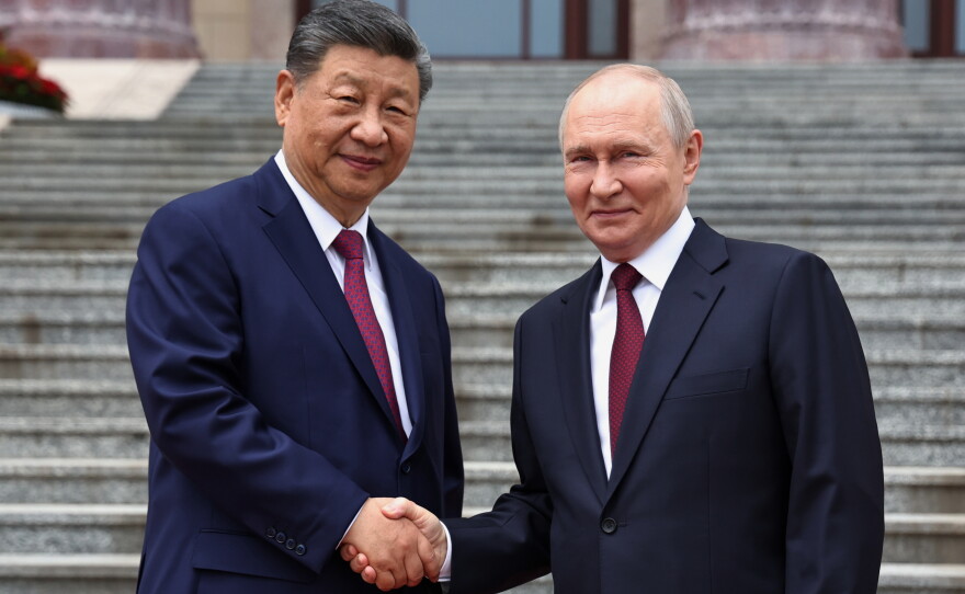 Russian President Vladimir Putin, right, and Chinese President Xi Jinping shake hands during a welcome ceremony at the Great Hall of the People, in Beijing, China, on Wednesday, May 20, 2026.