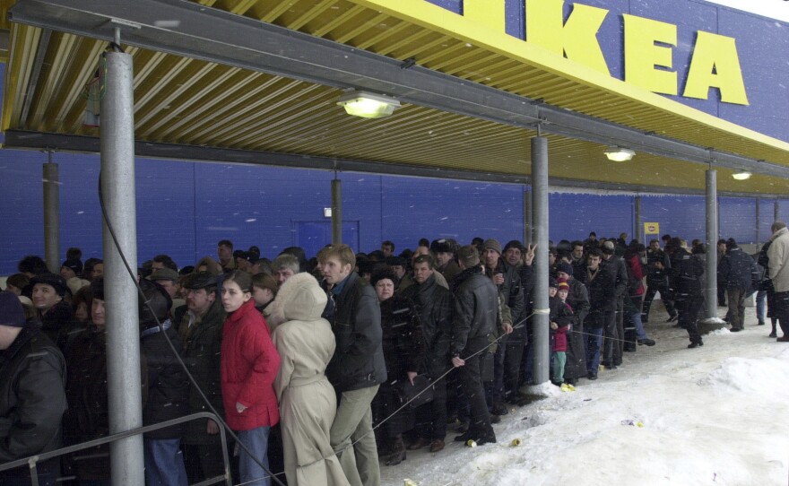 People line up to get inside the first IKEA store opened just outside Moscow, in this March 22, 2000 file photo.
