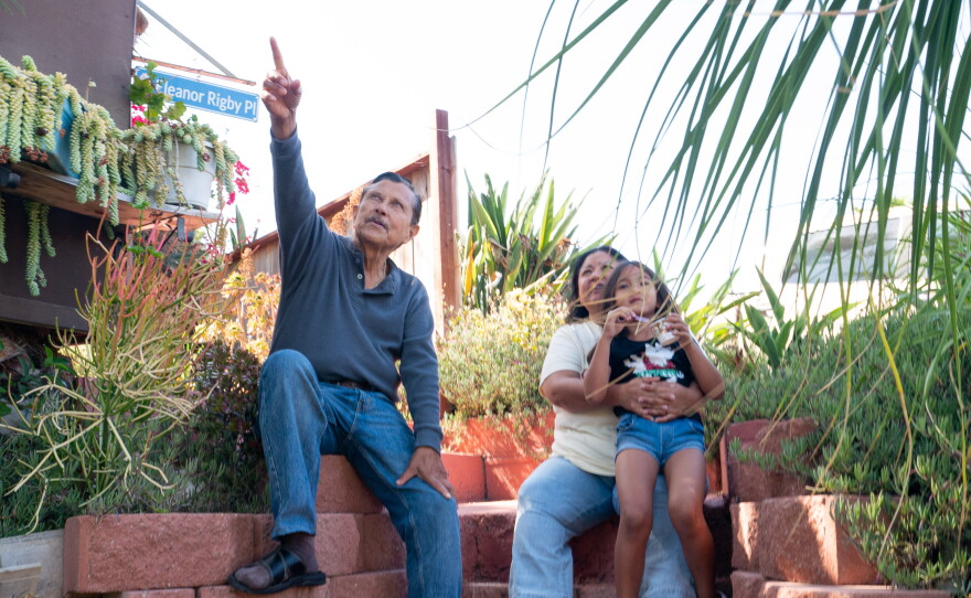 Alfonso Villamora talks about his garden with his daughter Cindy Villamora Henderson and granddaughter Eleanor Rigby Henderson on June 7, 2026.