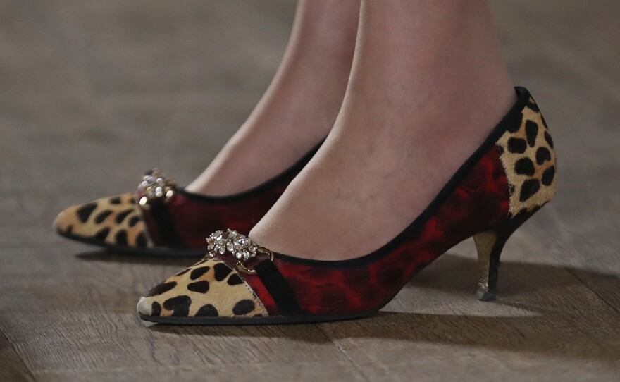 Theresa May, who will be Britain's next prime minister, often attracts media attention for her choice of footwear. She was wearing these leopard-print shoes at an event Monday in Birmingham, England.