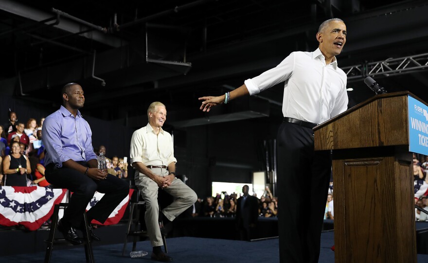 Former President Barack Obama speaks during a rally to support Florida Democratic gubernatorial candidate Andrew Gillum (left) and Sen. Bill Nelson, D-Fla., on Friday in Miami.