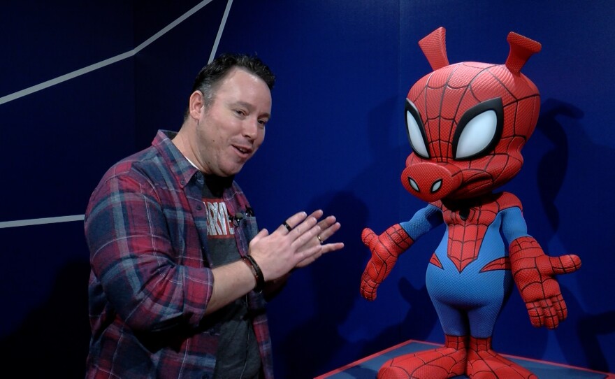 Brian Crosby, director of Marvel themed entertainment development, with his favorite item at the exhibit, Spider-Ham.