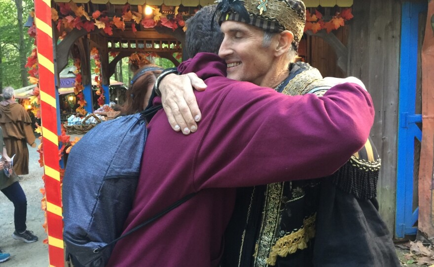 Johnny Fox hugs a fan at the Maryland Renaissance Festival. This fall, Fox has made a triumphant comeback even as he battles with health issues.