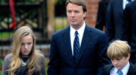 Former North Carolina senator and Democratic presidential candidate John Edwards and his children Emma Claire (L) and Jack leave the funeral services for Elizabeth Edwards at Edenton Street United Methodist Church on December 11, 2010 in Raleigh, North Carolina. 