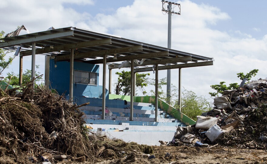 A soccer field in Toa Baja, Puerto Rico, has become an improvised dump site because the main municipal landfill is so busy.