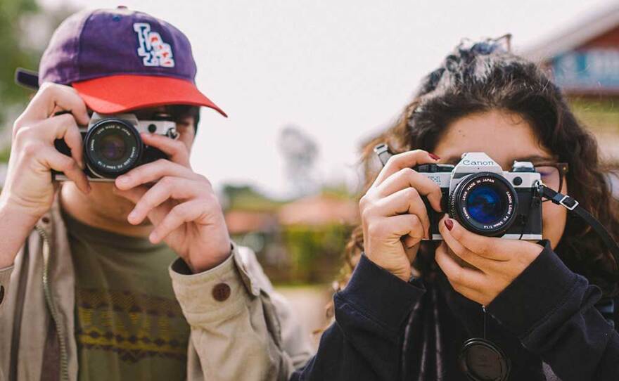 Youth photographers involved with Outside the Lens programming pose in an undated picture.