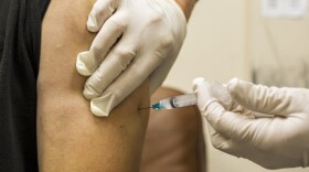 Juan Meza, a waiter in a West Hollywood restaurant, gets a free vaccine against bacterial meningitis at the AIDS Healthcare Foundation in West Hollywood, April 15, 2013.