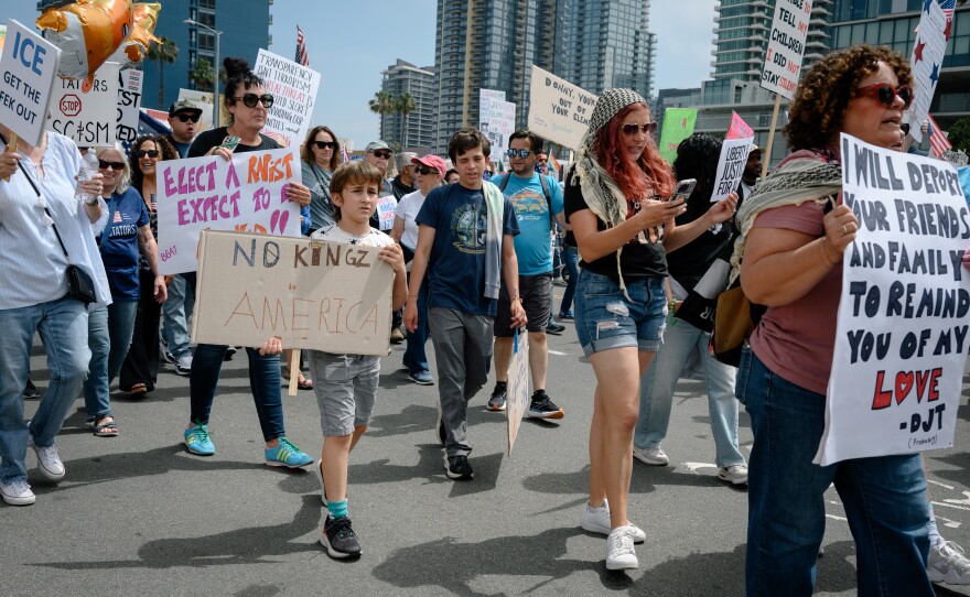 Thousands of people march through downtown San Diego, California to protest the Trump administration’s sweeping immigration crackdown and efforts to consolidate power on June 14, 2025.