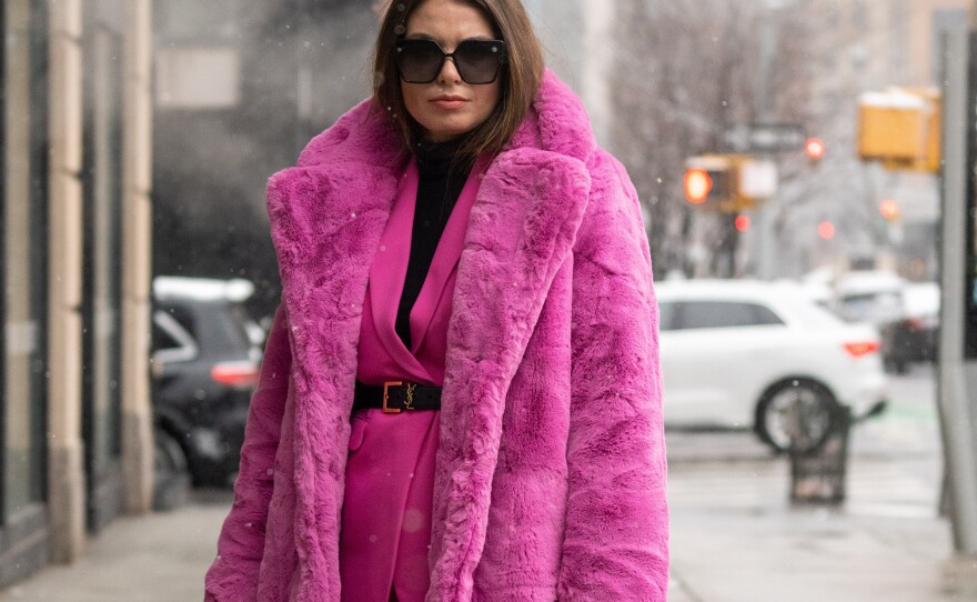 Natalia Levsina wears a faux fur coat by Apparis to New York Fashion Week in 2022.