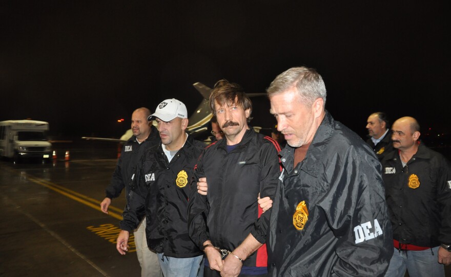 In this photo provided by the U.S. Department of Justice, Russian arms trafficking suspect Viktor Bout deplanes after arriving at Westchester County Airport in New York on Nov. 16, 2010. Bout was extradited from Thailand to the U.S. to face terrorism charges.