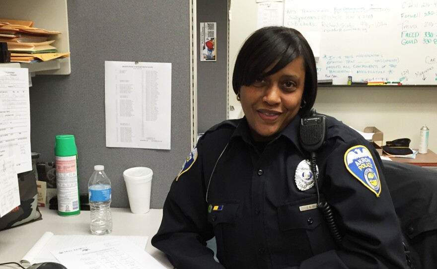 Carol Hill says her work as a social worker was good training for joining the Akron police force. She's part of the force's recruiting team that's boosting its diversity efforts.