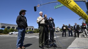 San Diego County Sheriff Bill Gore, center, speaks at a news conference held outside of the Chabad of Poway Synagogue Saturday, April 27, 2019, in Poway, Calif. Several people were injured in a shooting at the synagogue. 
