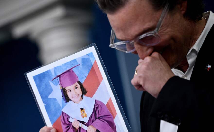 Actor Matthew McConaughey chokes up as he holds a photo of Alithia Ramirez, a 10-year-old student who was killed in the mass shooting at Robb Elementary School in his native Uvalde, Texas, while speaking during the daily press briefing at the White House on Tuesday. McConaughey has been meeting with senators to discuss gun reform.