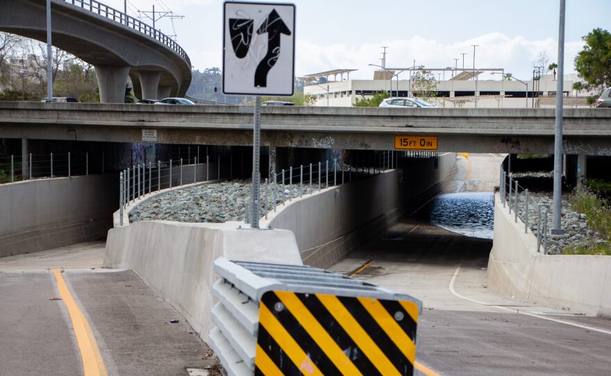 Rainwater pooled at the deepest point in the Hazard Center Drive underpass the day after a light storm in the Mission Valley neighborhood of San Diego on March 5, 2022.