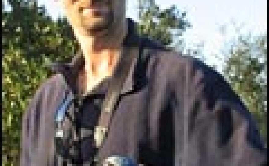 Archbold Research Assistant Chris Valligny demonstrates the correct way to hold the scrub-jay.