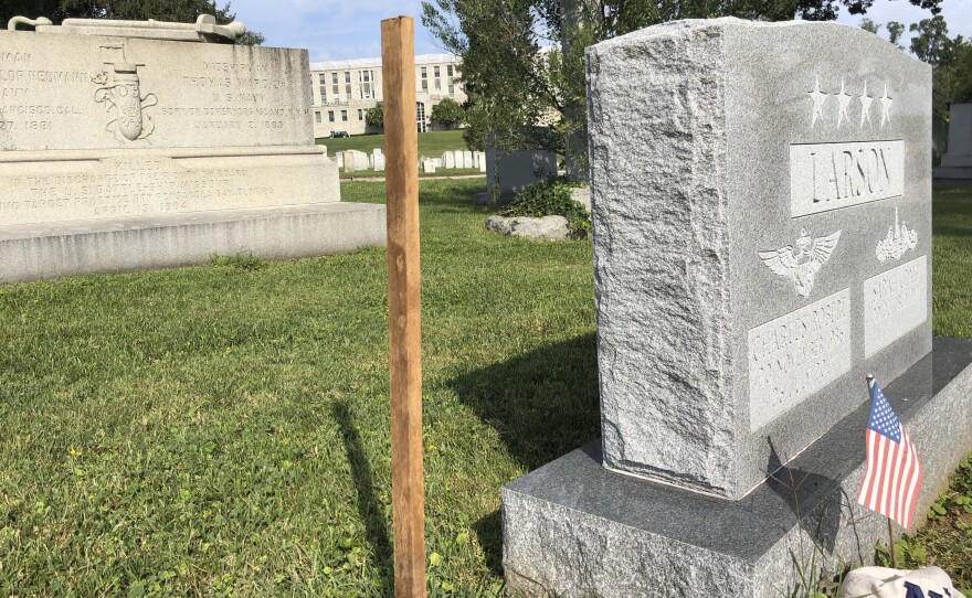 A wooden spike marks the spot, Saturday, Aug. 25, 2018 where Sen. John McCain, R-Ariz., will be buried on the grounds of the U. S. Navel Academy in Annapolis, Md. 